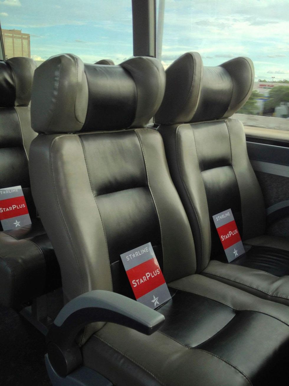 Starline bus service to football games interior with reserved markers on seats