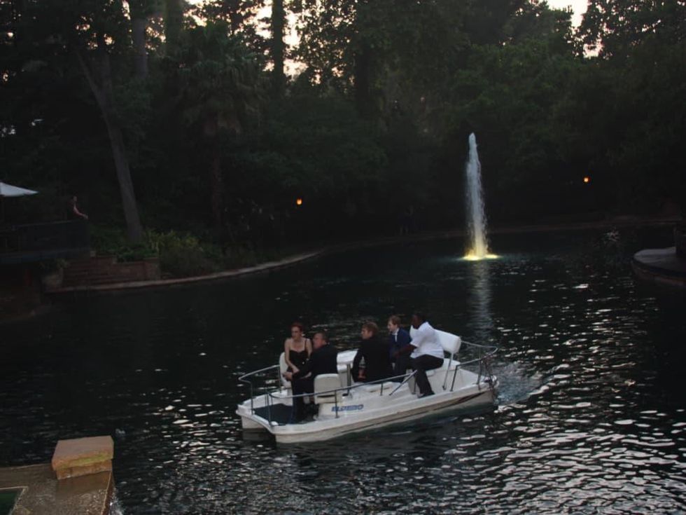 Steele party,Dalton Gray and Major Dodson are being given a boat ride across the Van Dykes pool by property manager Harold Robinson with other guests