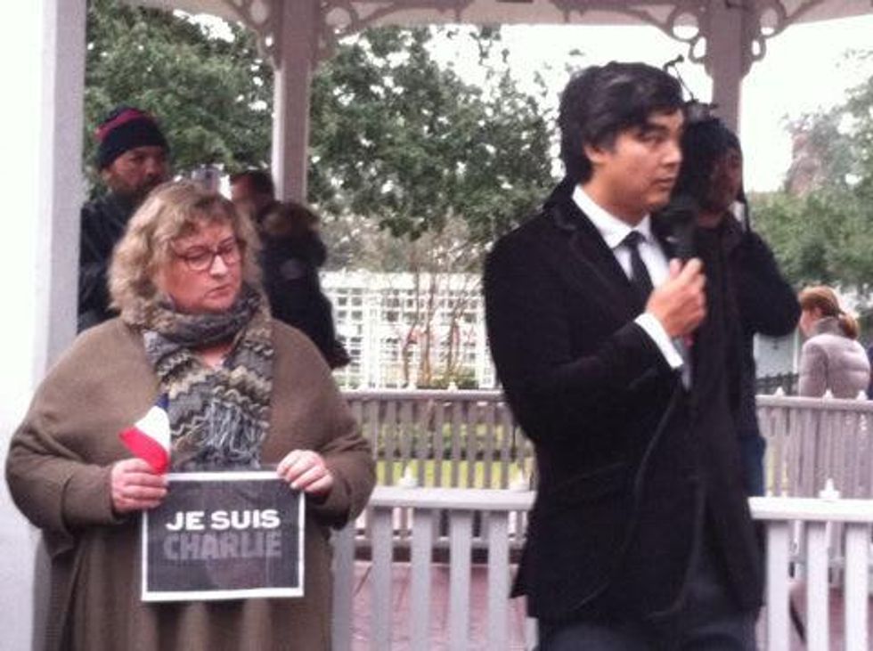 Sujiro Seam, Consul General of France, speaks to crowd at rally at Sam Houston Park