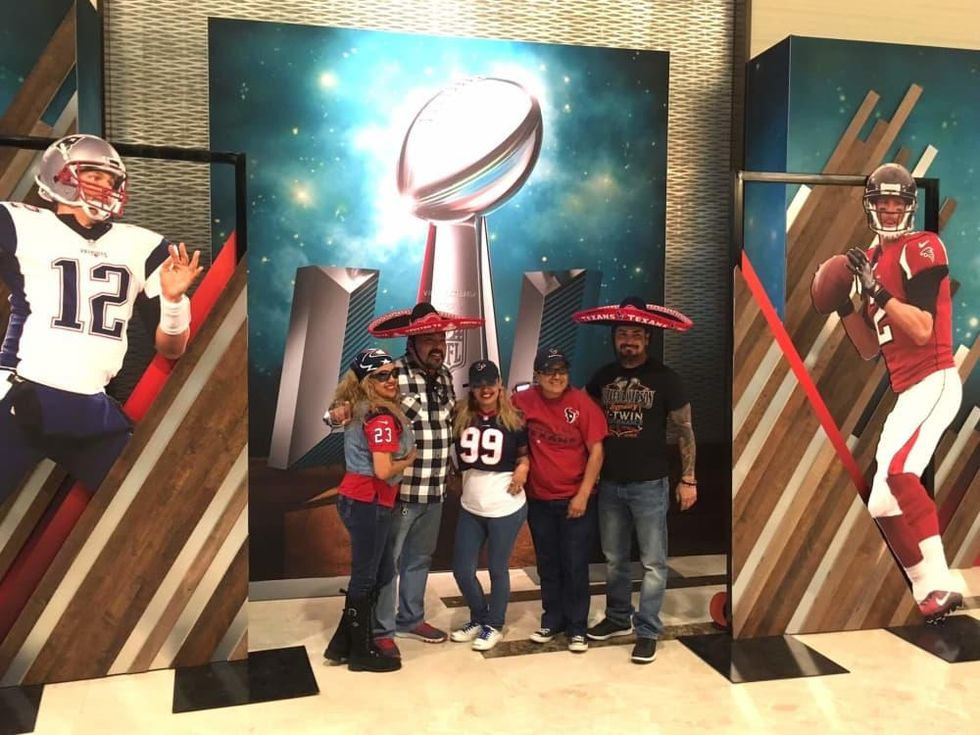 Super Bowl fans posing at Marriott Marquis hotel