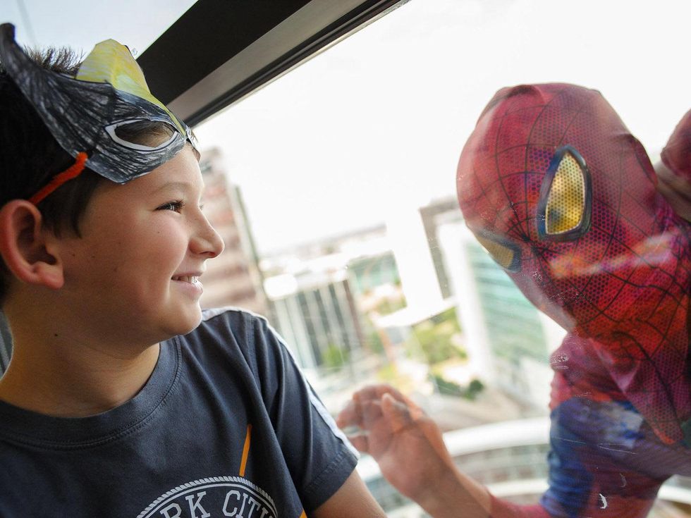 Superhero window washers surprise patients at Texas Children's Hospital