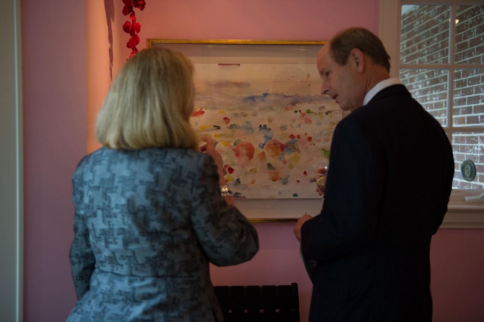 Susan Bischoff and Eddie Allen in front of the Jim Dine watercolor at Planned Parenthood Fine Art Auction