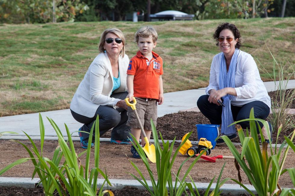 Susan Christian, Laura Spanjian and child at Mandell Park dedication August 21, 2014