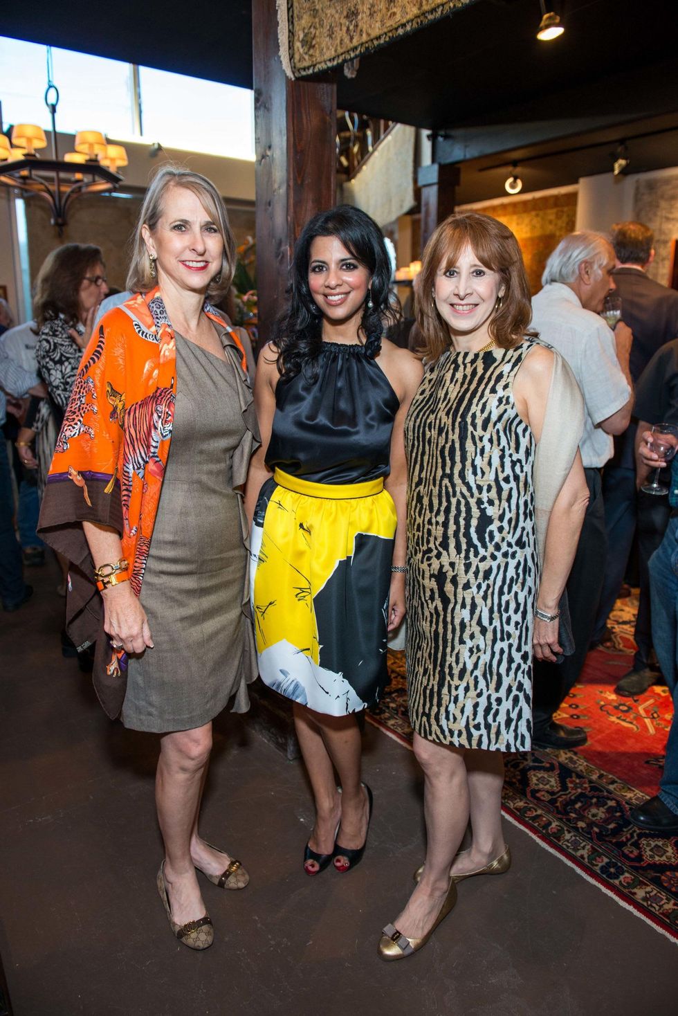 Susan Hansen, from left, Elizabeth Abraham and Vicki West at the Abraham's Oriental Rug dinner September 2014