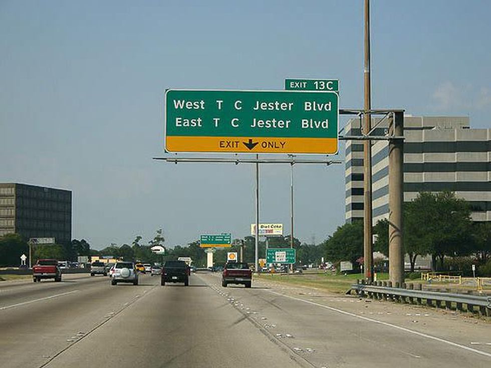 T.C. Jester Boulevard sign over highway SMALL