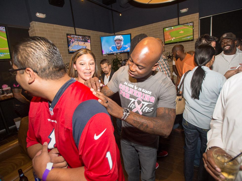 Tailgating for a Cure hosted by Houston Texans Johnathan Joseph and Kareem Jackson October 2013 Johnathan Joseph signing autographs