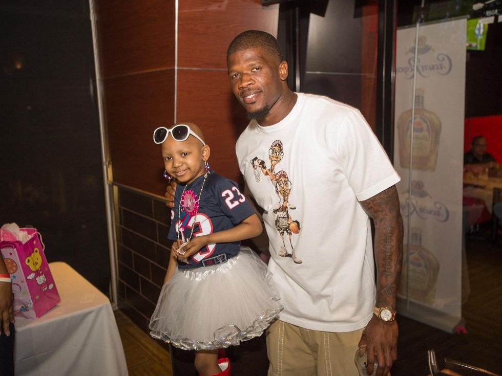 Tailgating for a Cure hosted by Houston Texans Johnathan Joseph and Kareem Jackson October 2013 Kyssi Andrews and Andre Johnson