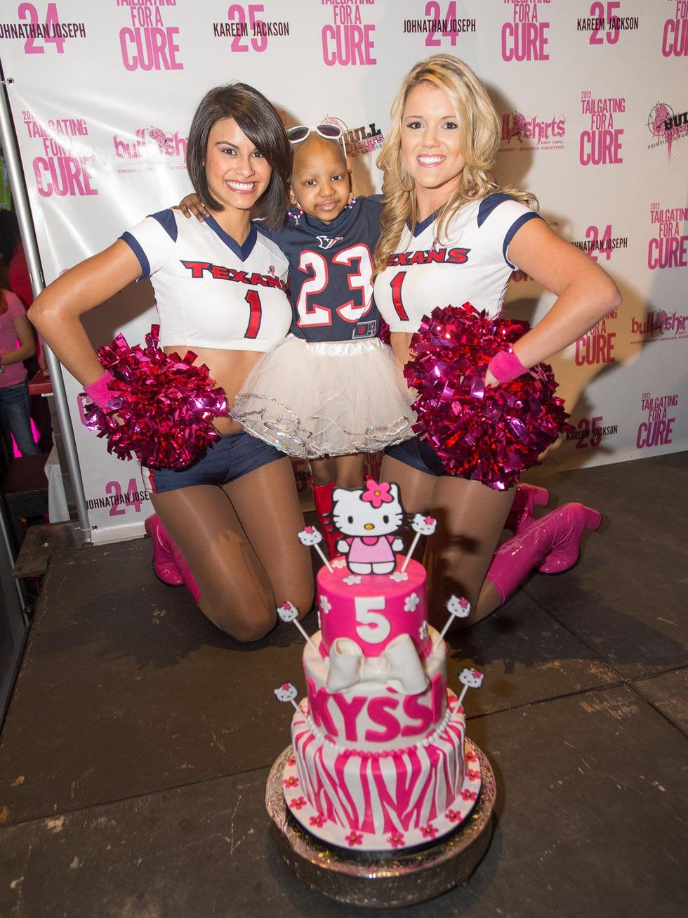 Tailgating for a Cure hosted by Houston Texans Johnathan Joseph and Kareem Jackson October 2013 Texans cheerleaders with Kyssi Andrews