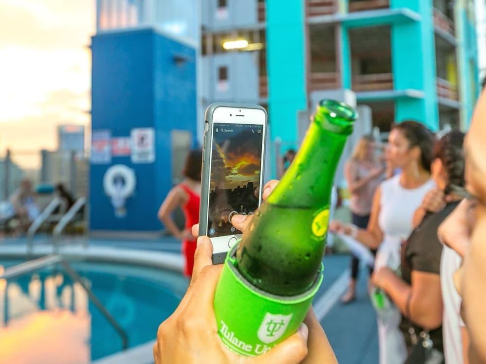 Taking a photo of sunset at CultureMap Country Club Social