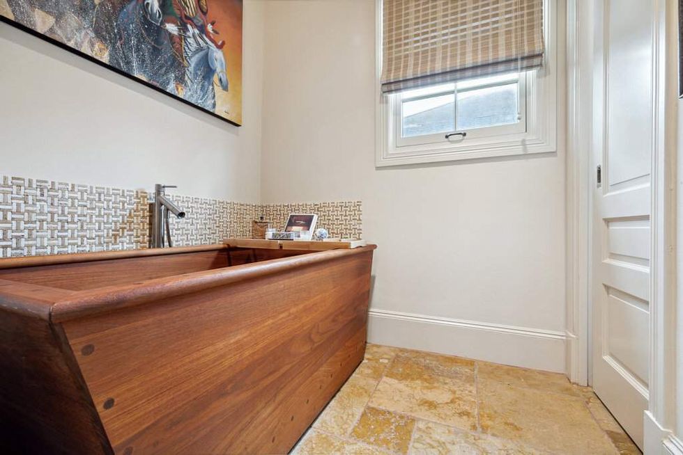Teak soaking tub at 3207 Sackett St.