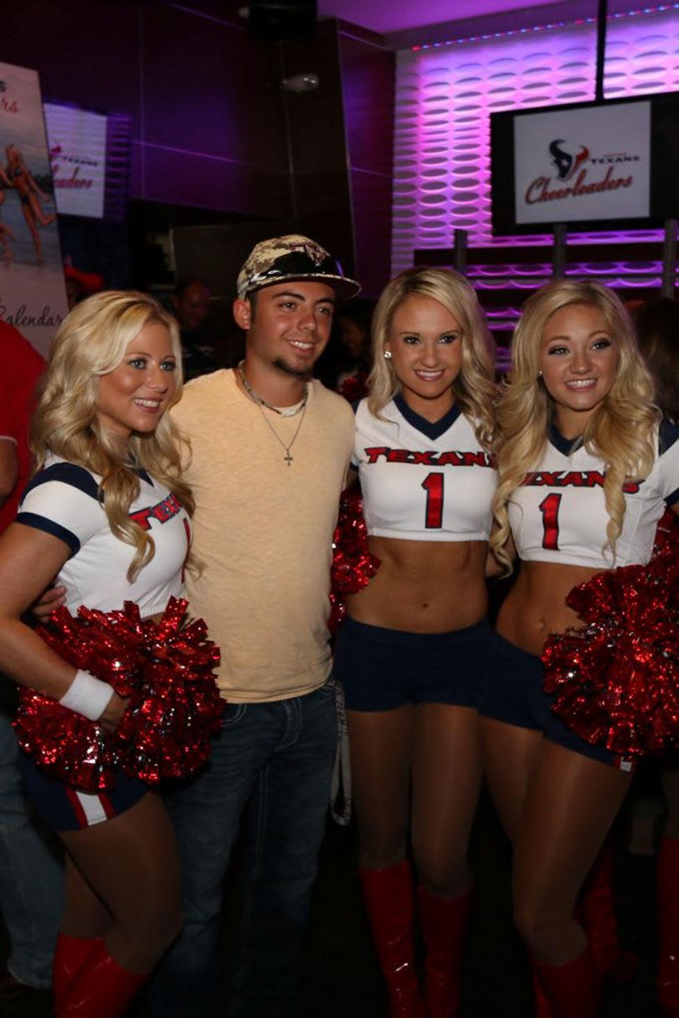 Texans cheerleaders signed copies of the new swimsuit calendar at the