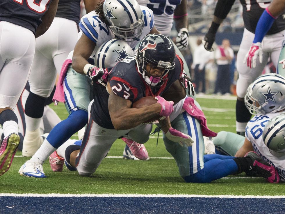 Texans vs. Cowboys Oct. 5, 2014 Texans 23 being tackled
