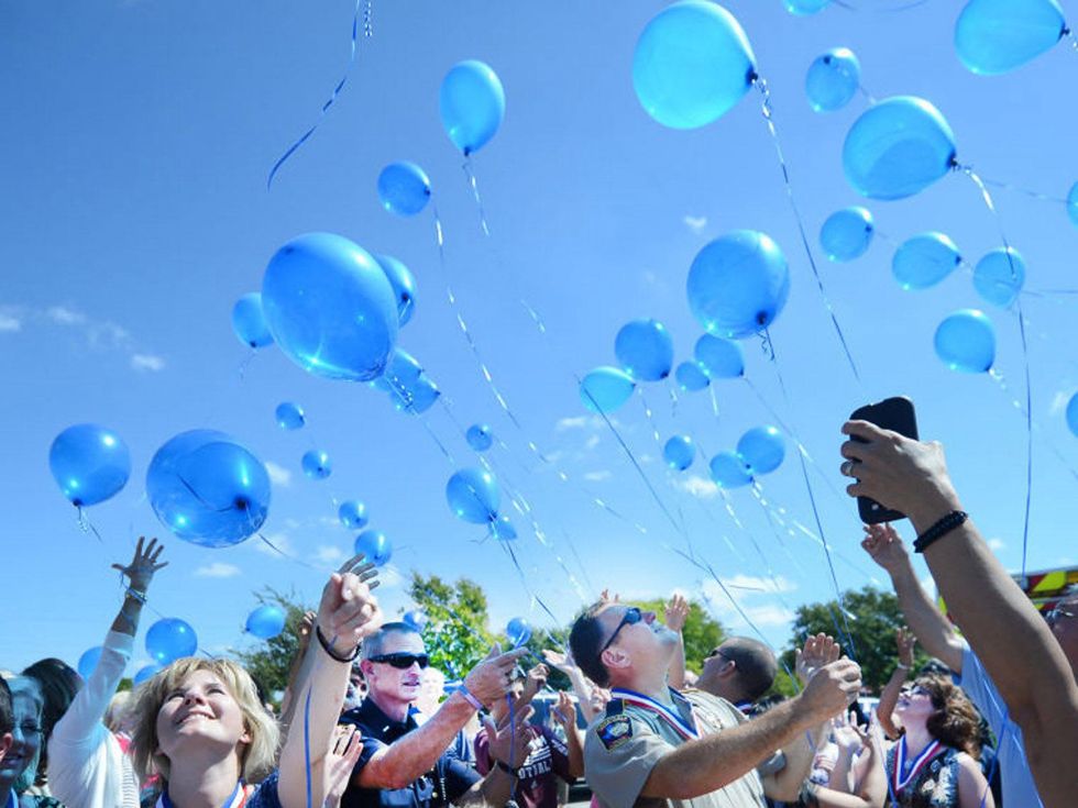 Texas A&M shooting anniversary releasing balloons