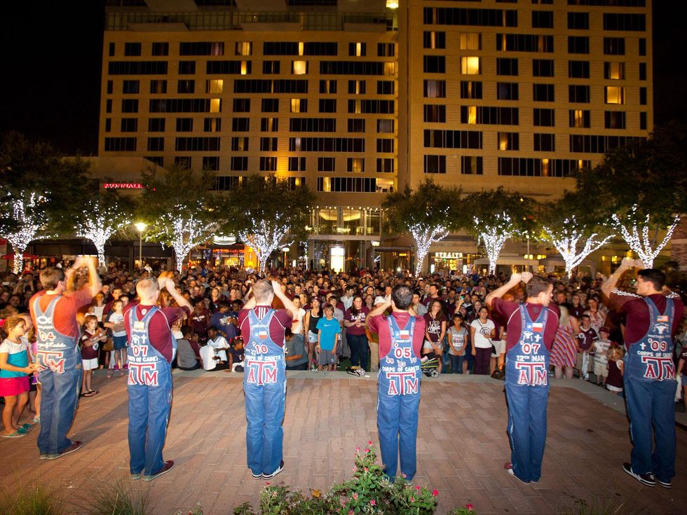 Texas A&M yell practice at CityCentre September 2013 yell leaders leading yell