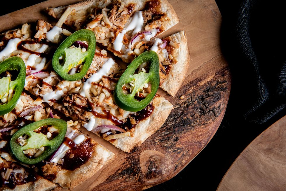 Th ePitmaster flatbread with jalapenos, onions, chicken, and barbeque sauce