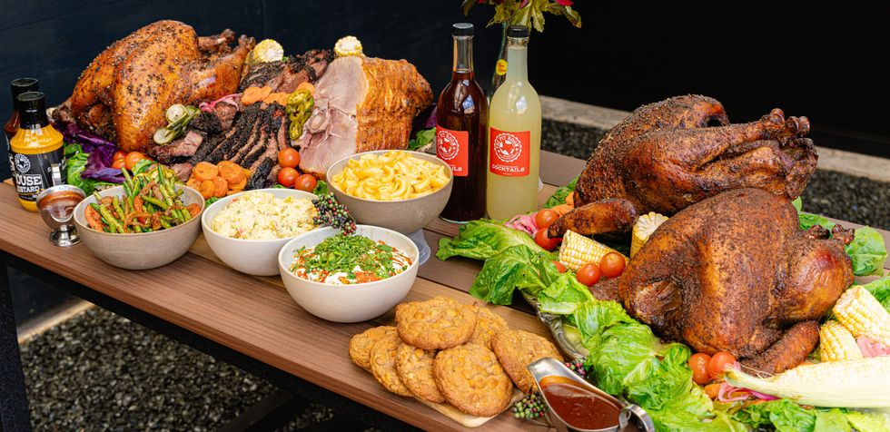 Thanksgiving turkey, ham and sides on a table