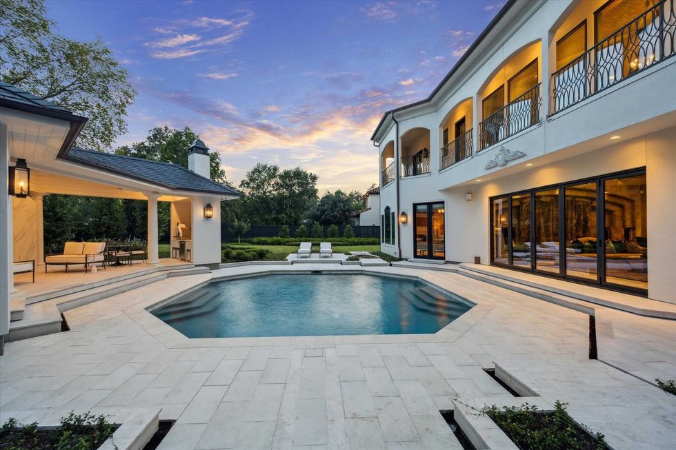 The backyard and pool of 11095 Memorial Drive