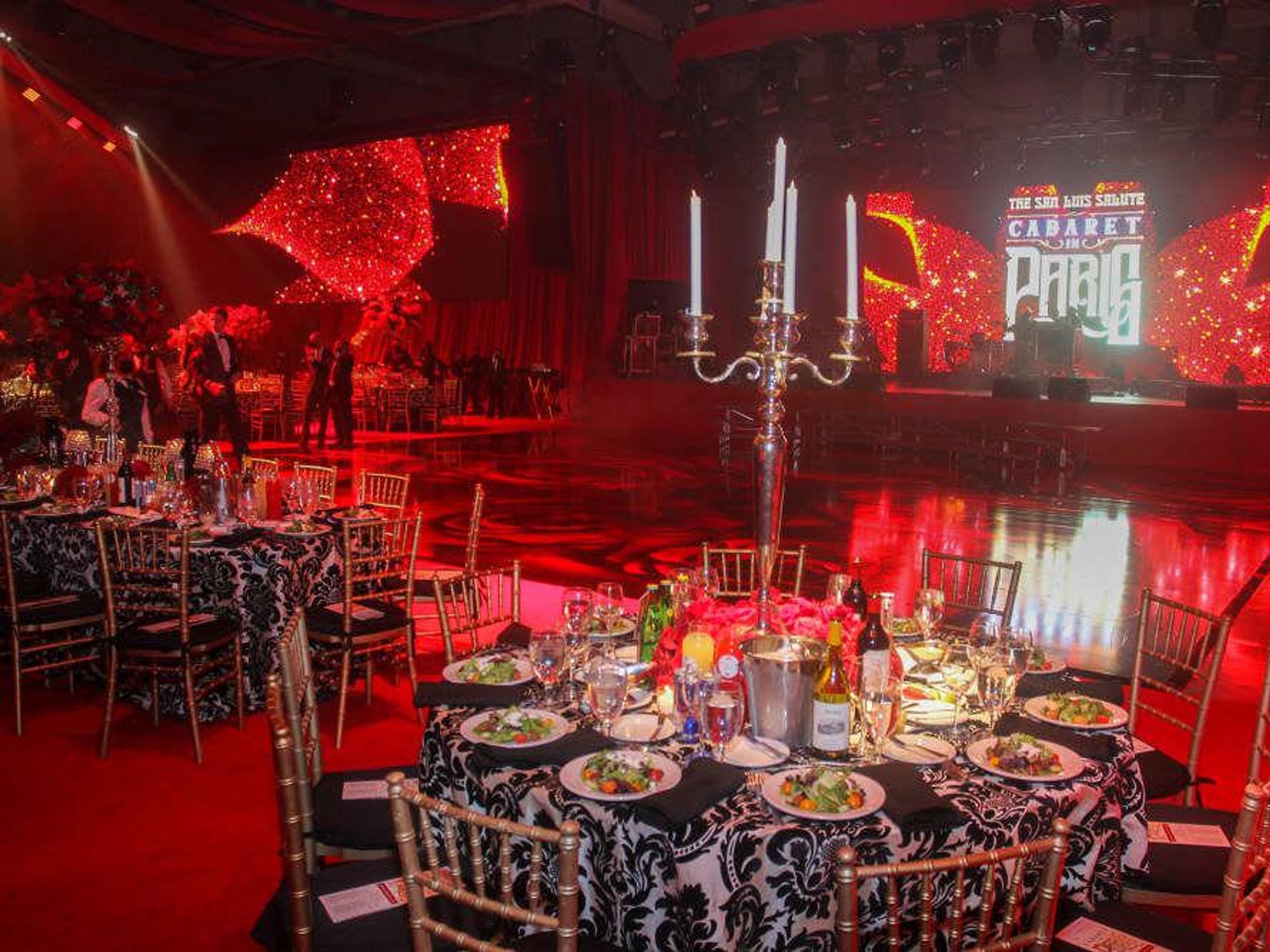 The crimson-adorned ballroom.