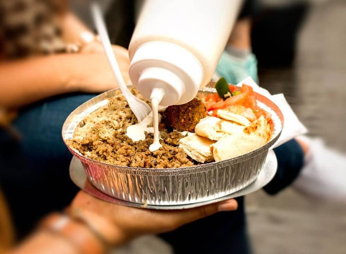 The Halal Guys are known for their meat platters, which are served over