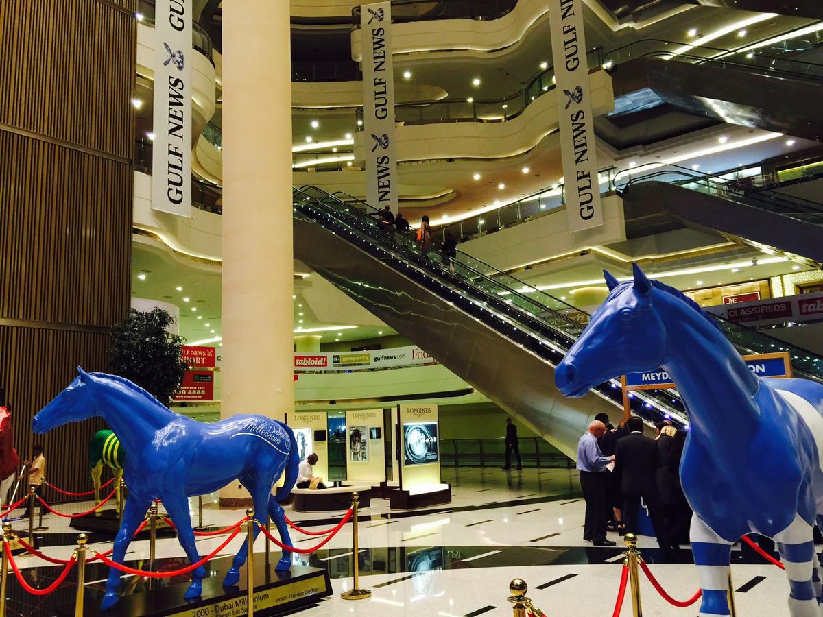 The interior of the Meydan Racecourse is a sleek, contemporary wonder ...