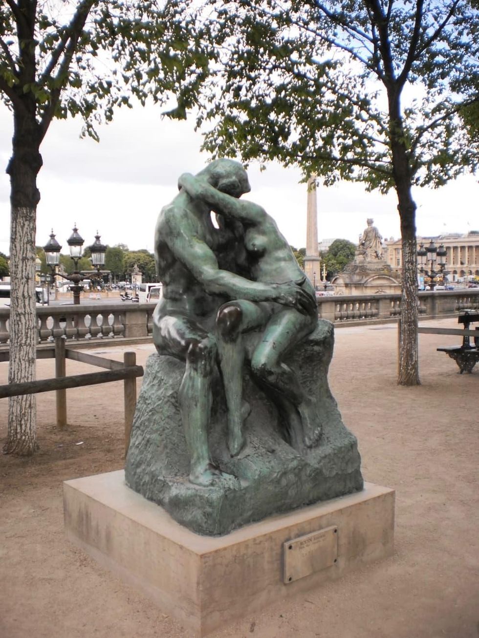 The lovers in Rodin's "The Kiss" sculpture outside Musee de l'Orangerie in Paris