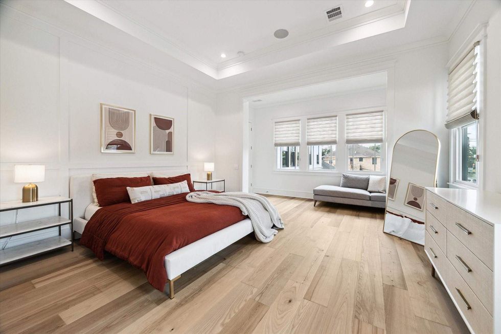 The primary bedroom of 1039 Harvard Street, with space for sleeping and sitting.