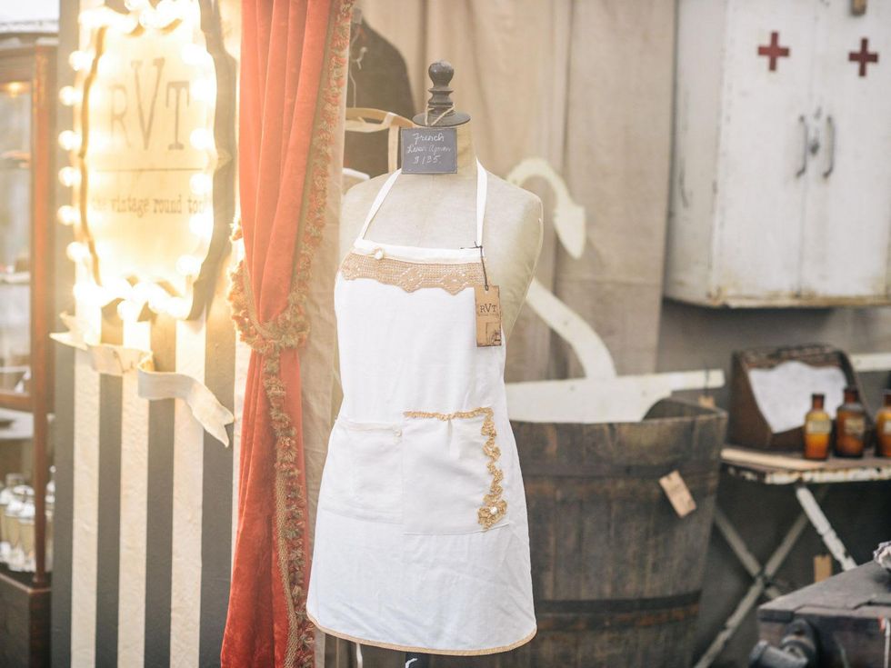 The Vintage Round Top apron at booth