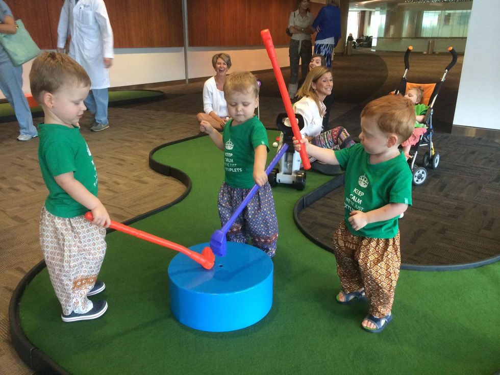 Three of the Perkins sextuplets play at the Bad Pants Open kickoff party at Texas Children's Hospital
