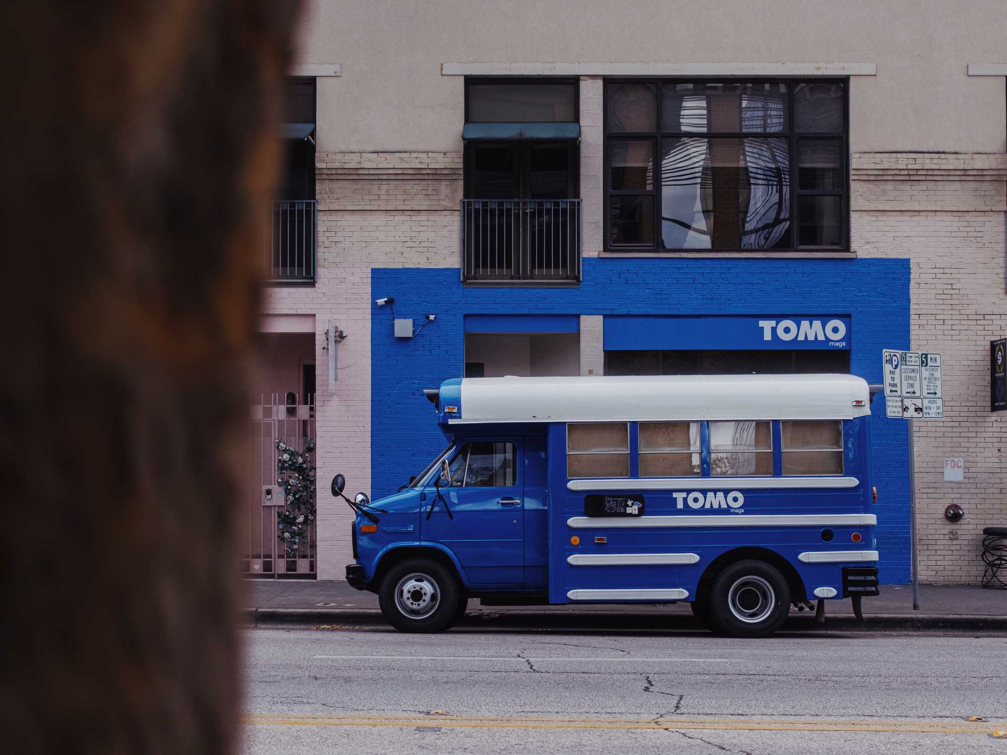Tomo Mags bus outside of brick-and-mortar Austin store