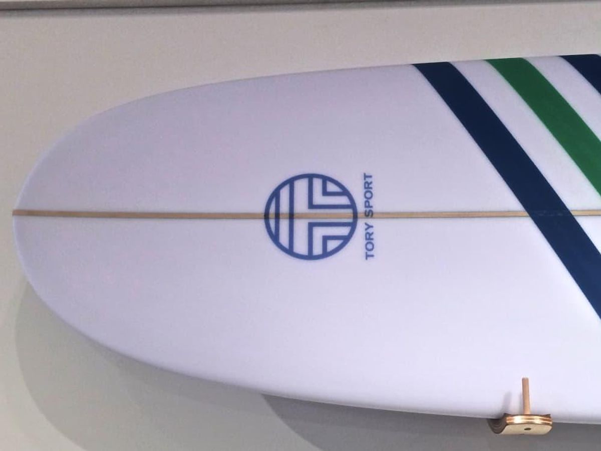 A Tory Burch surfboard dominates one wall in the New York popup shop