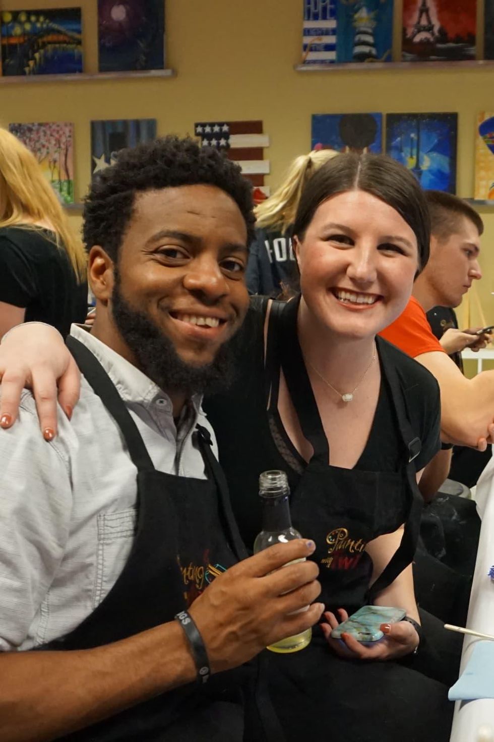 Two people enjoying Painting With a Twist