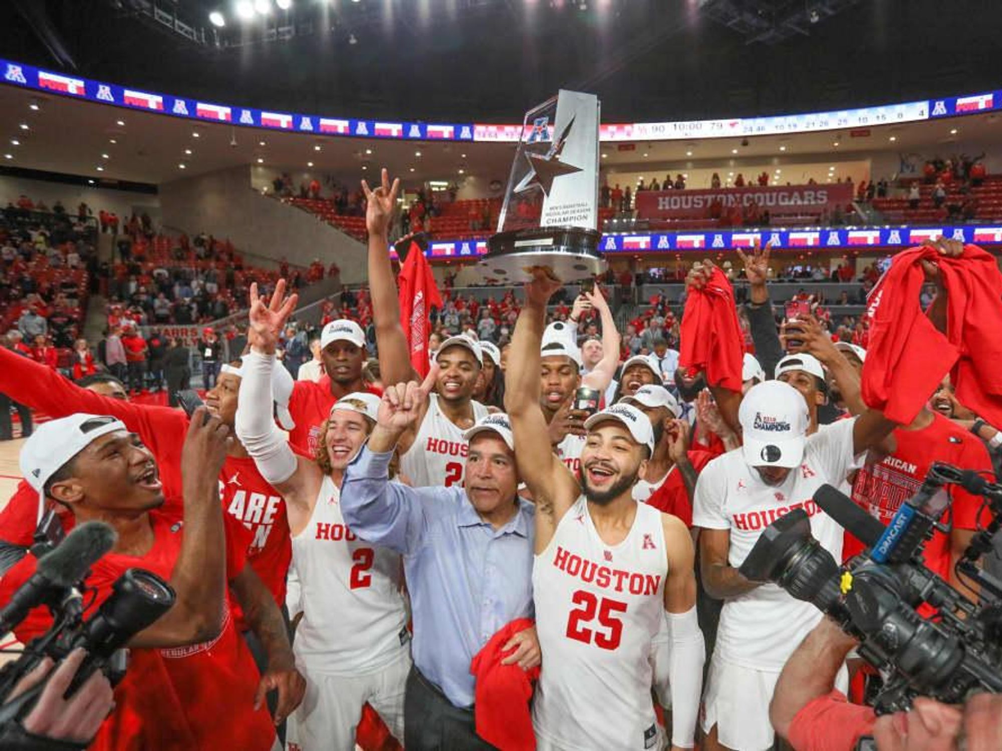 University of Houston UH Cougars men's basketball team celebrating