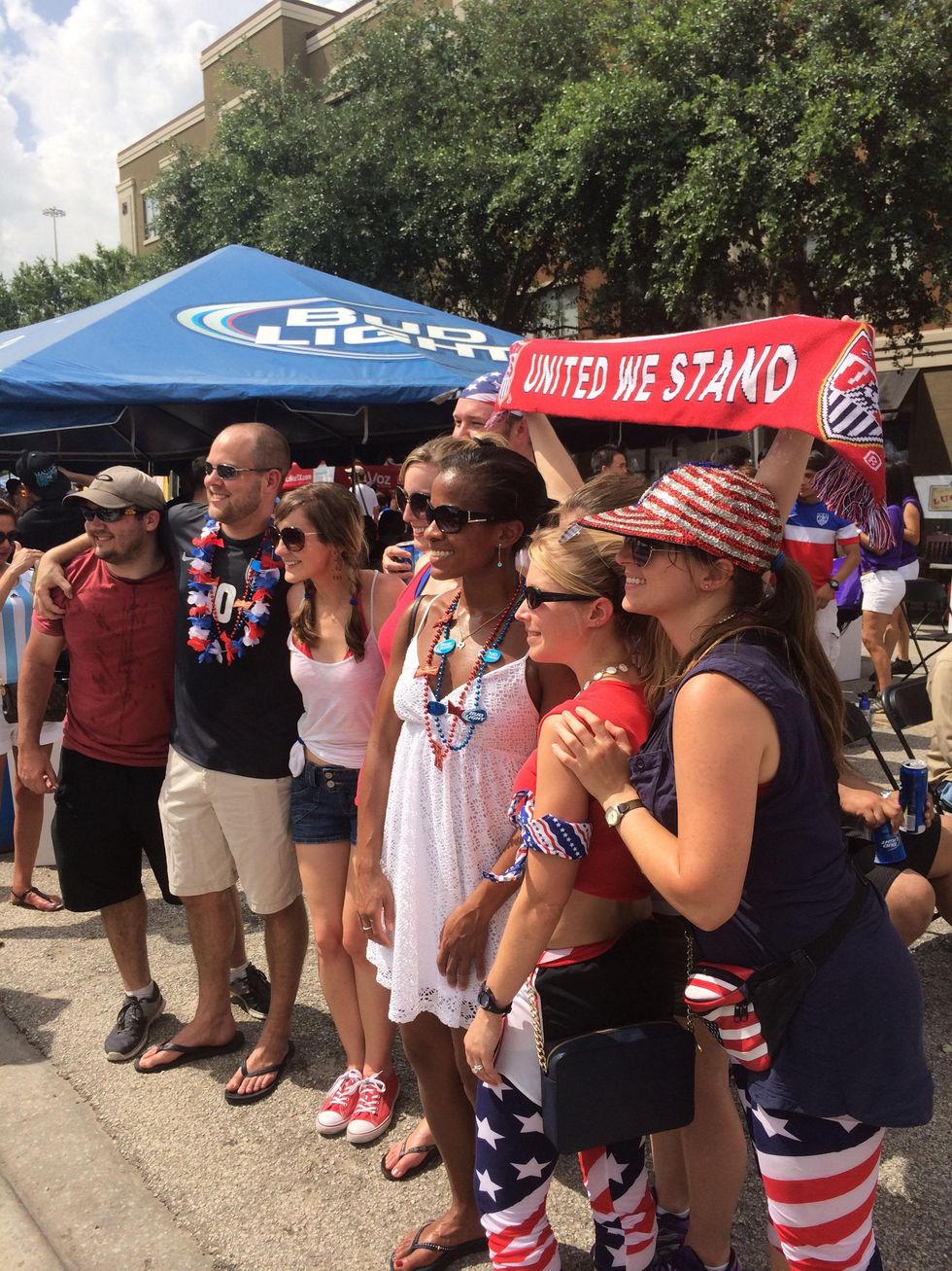 USA soccer fans decked out in red, white and blue from head to toe.