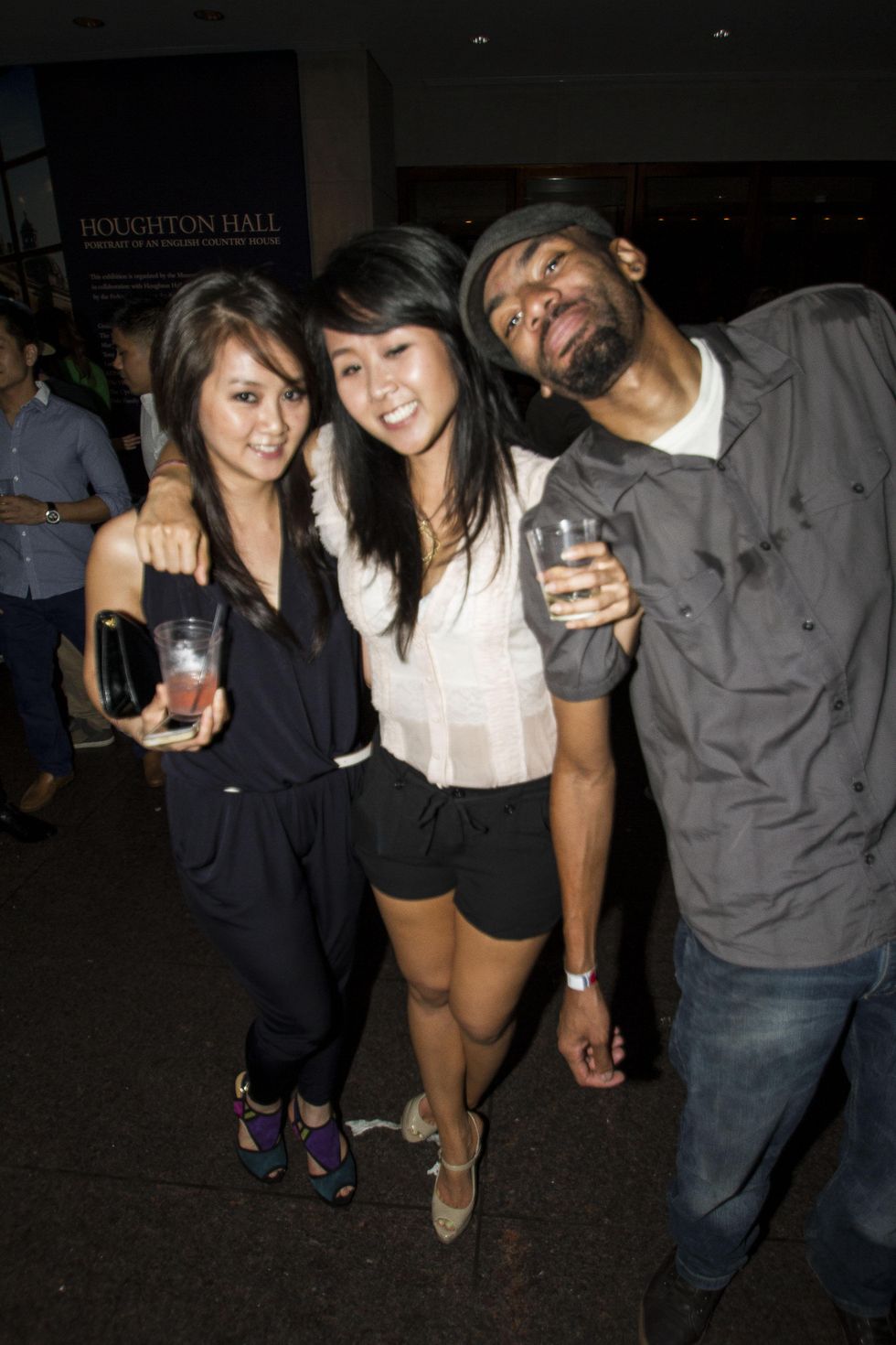 Uyen Pham, from left, Nhi Pham and Darius Brown at the MFAH Mixed Media Party June 2014