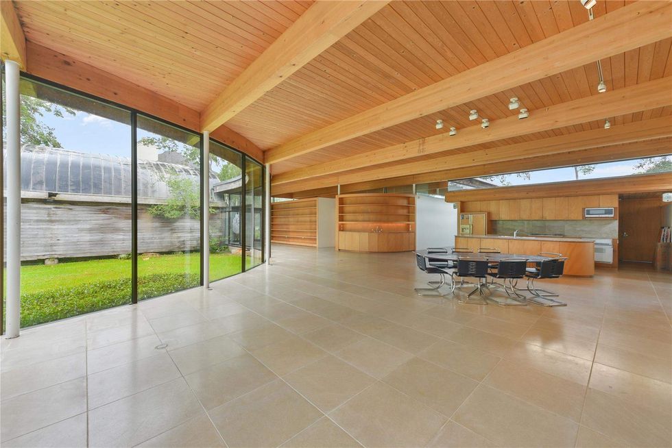 View into the dining and kitchen areas of 701 Mulberry Lane