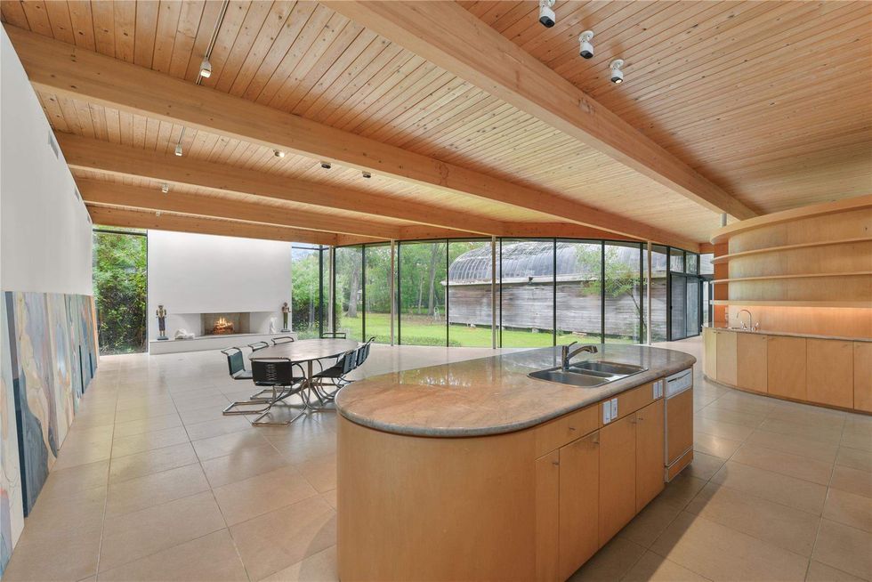 View of the open plan living space looking out to the backyard of 701 Mulberry Lane.