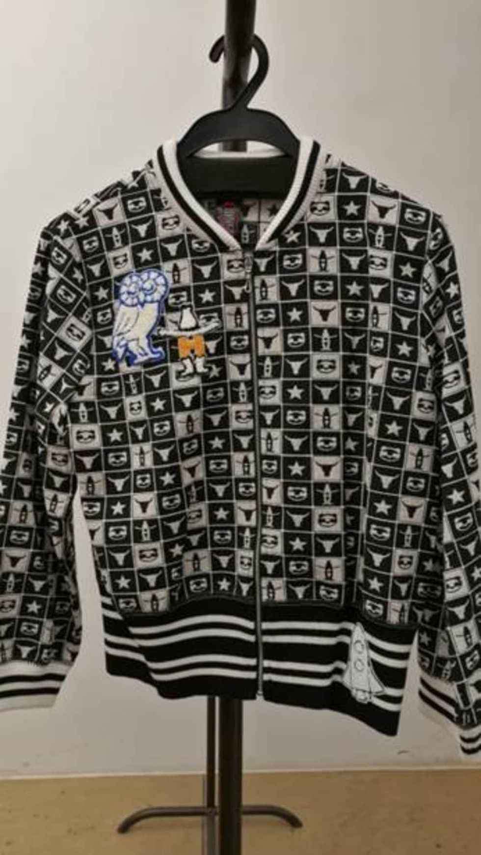 Vivenne Tam checkerboard jacket with Rice and Rodeo logos