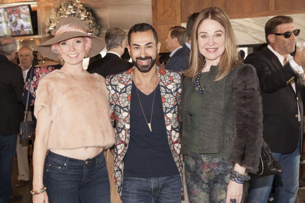 Vivian Wise, from left, Fady Armanious and Becca Cason Thrash at Neal Hamil's birthday party November 2014