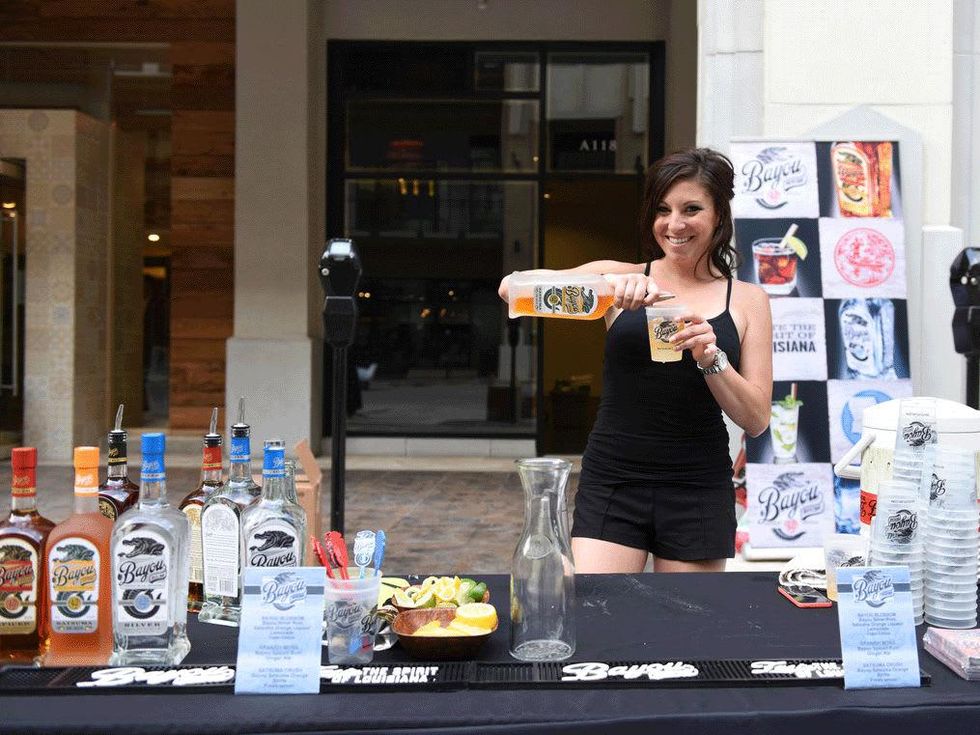 West Ave Destination Design Bayou Rum rep serving drinks