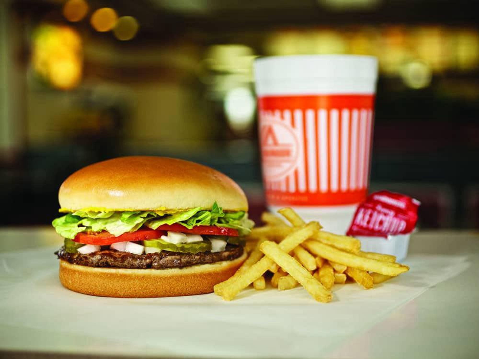 Whataburger hamburger and fries and drink