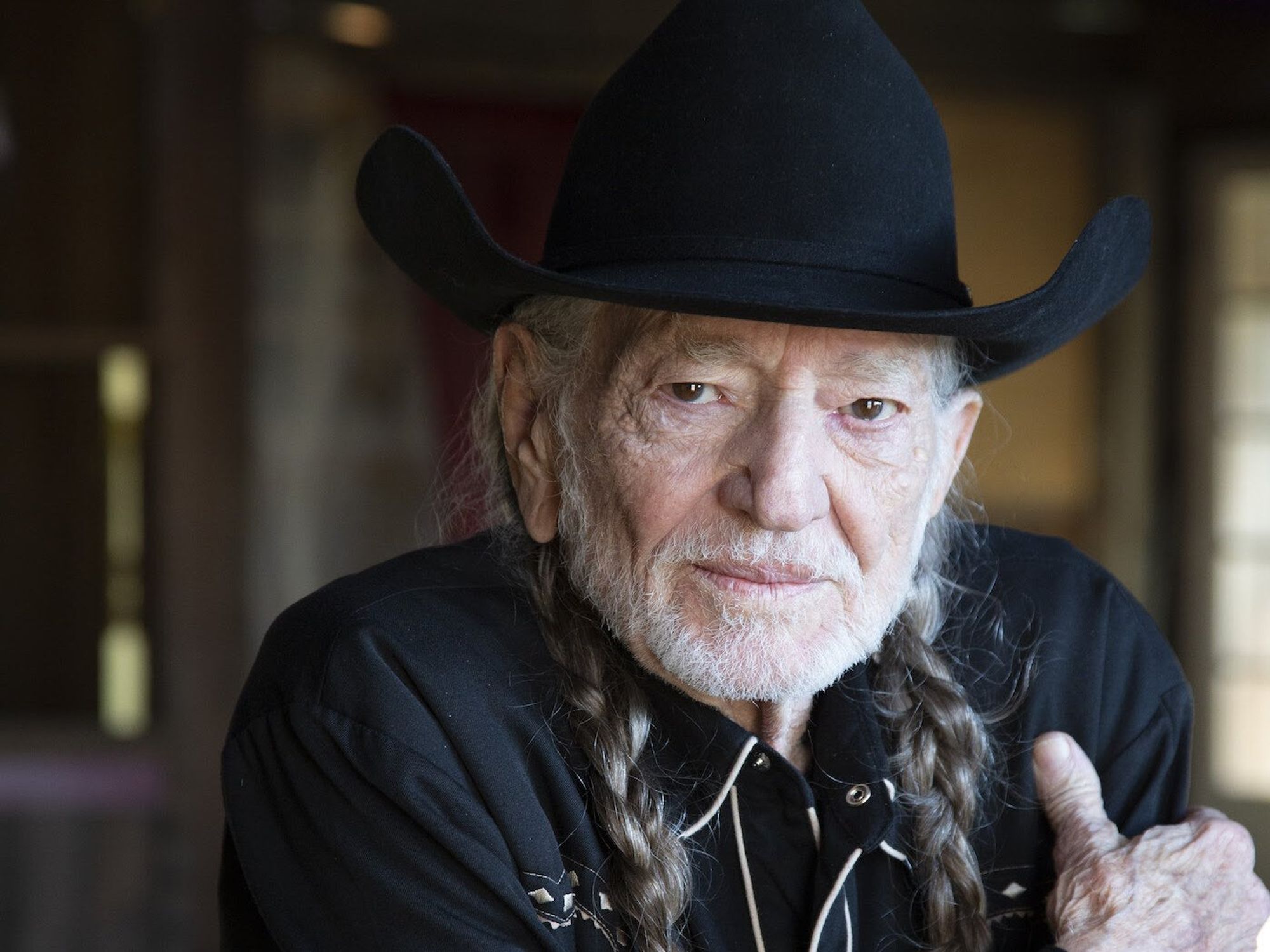 Willie Nelson headshot promoting Bluegrass