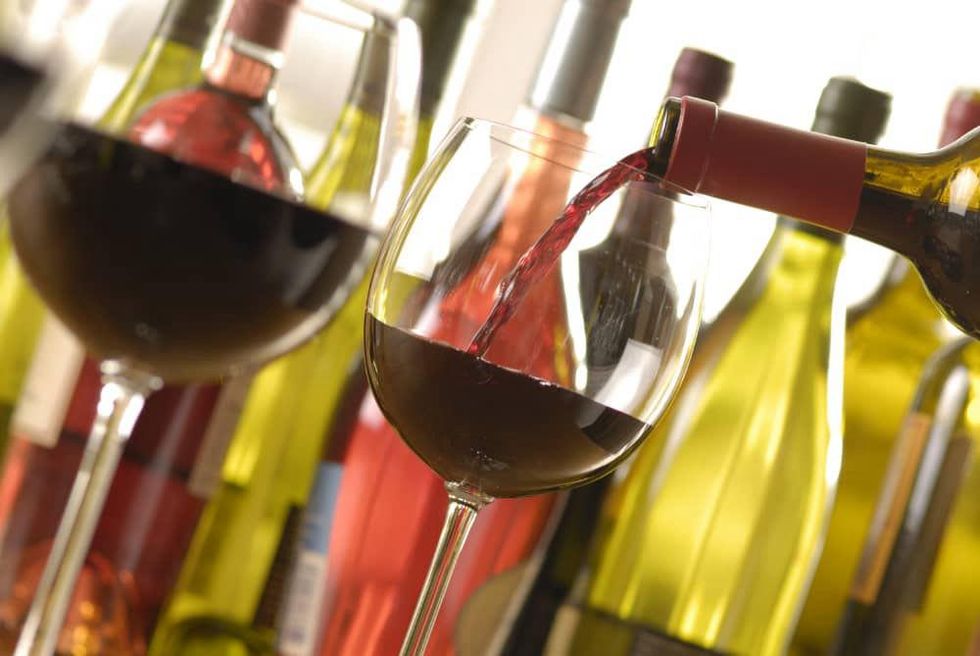 wine glasses pouring wine bottles of wine