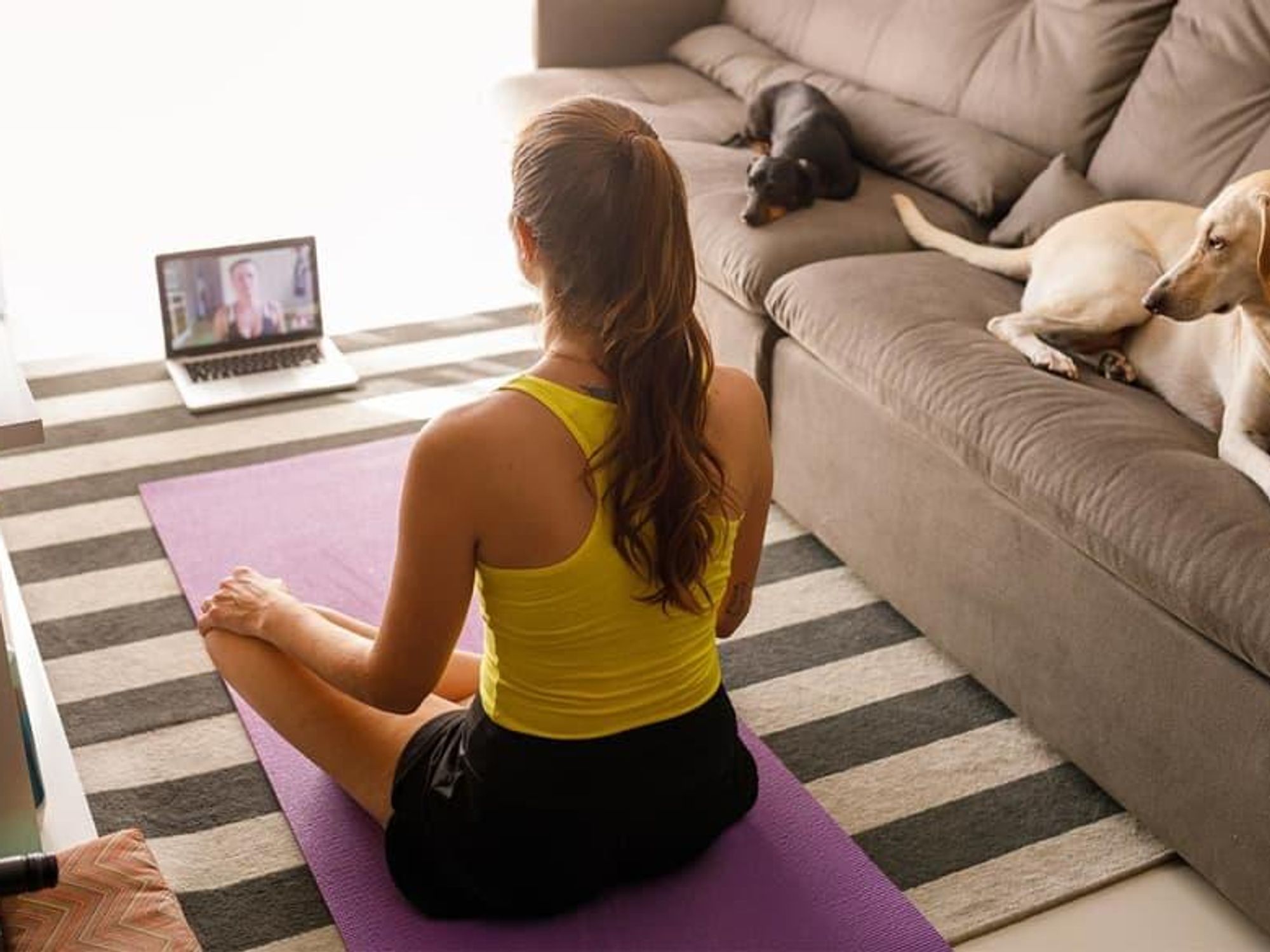 Woman doing virtual yoga