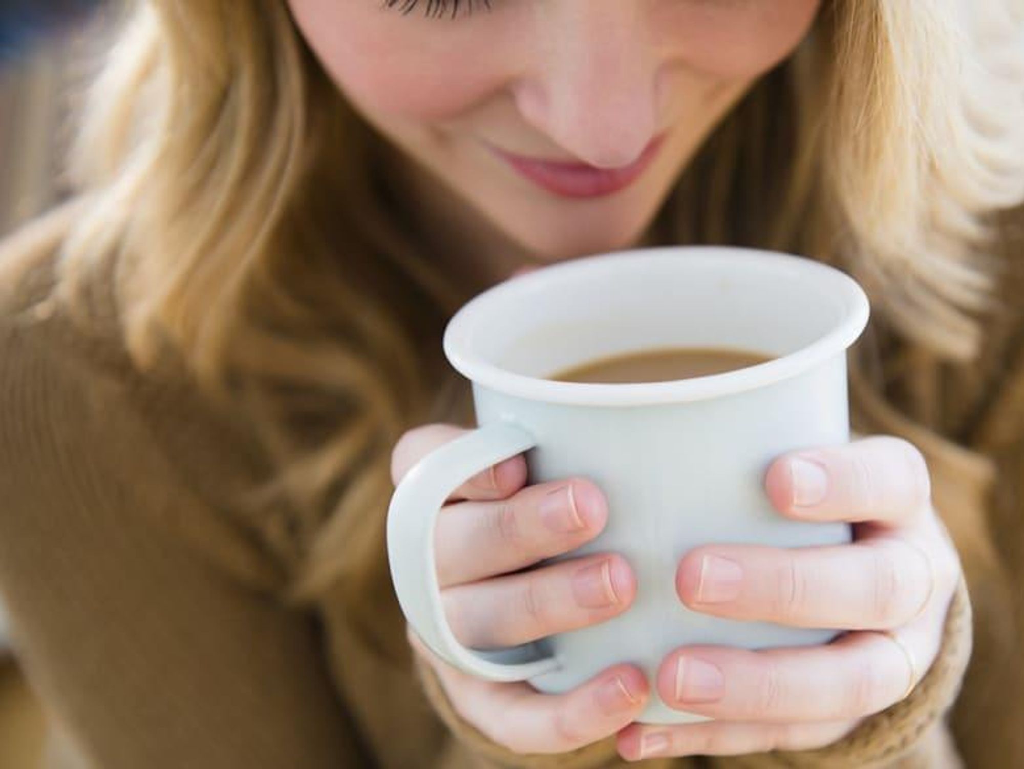 Woman holding a cup of coffee