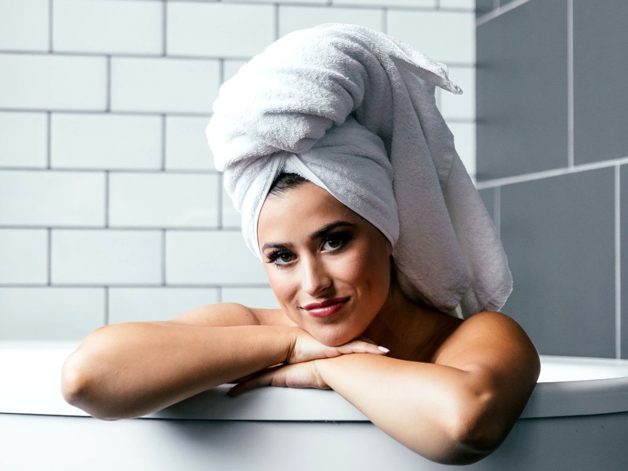 https://houston.culturemap.com/media-library/woman-in-bath-with-towel.jpg?id=33324226&width=2000&height=1500&quality=85&coordinates=0%2C0%2C0%2C0