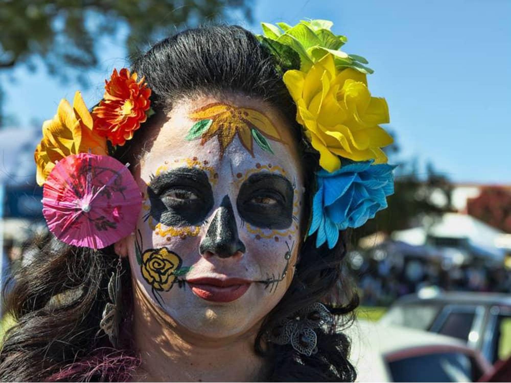 woman in Dia de Los Muertos skull face paint