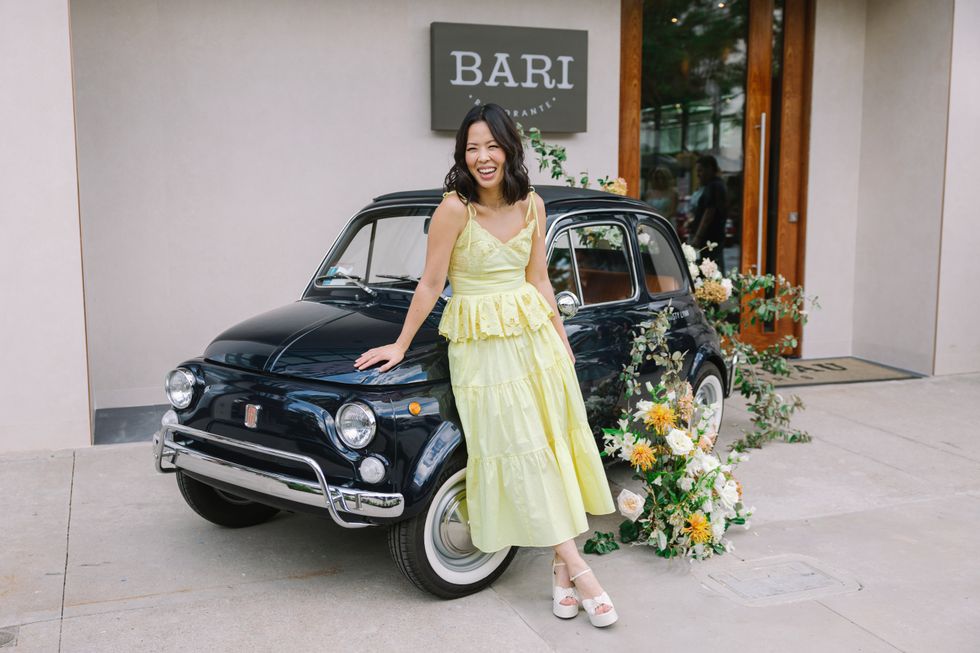 woman in front of car