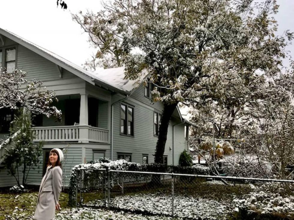 Woman in snowy Heights neighborhood snow ice freeze Houston