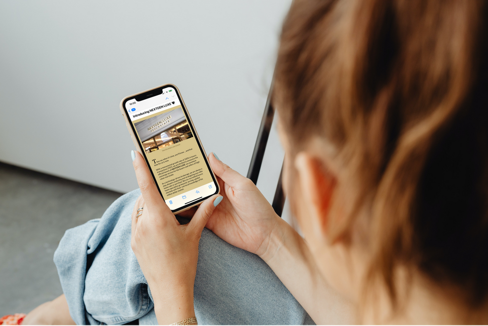 Woman looking at NextGen Real Estate on her phone