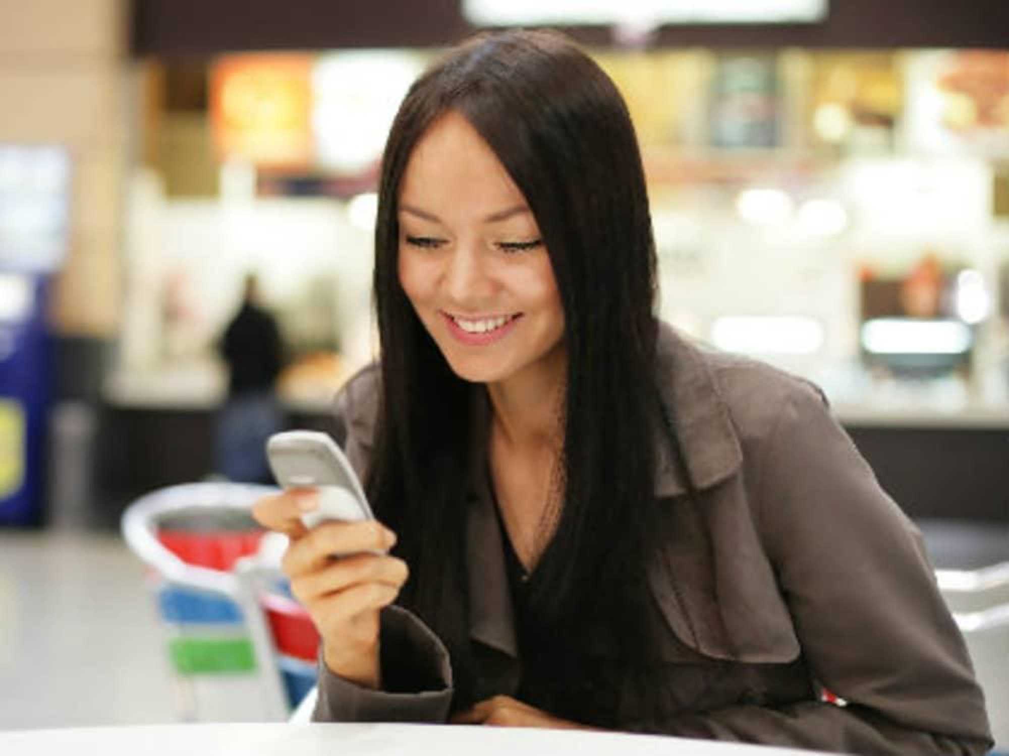 Women on her cellphone in a mall